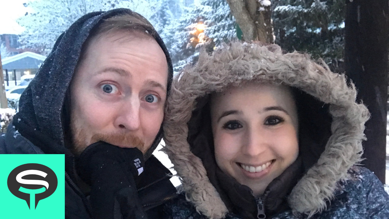 Jon and Erica outside wearing their winter clothes