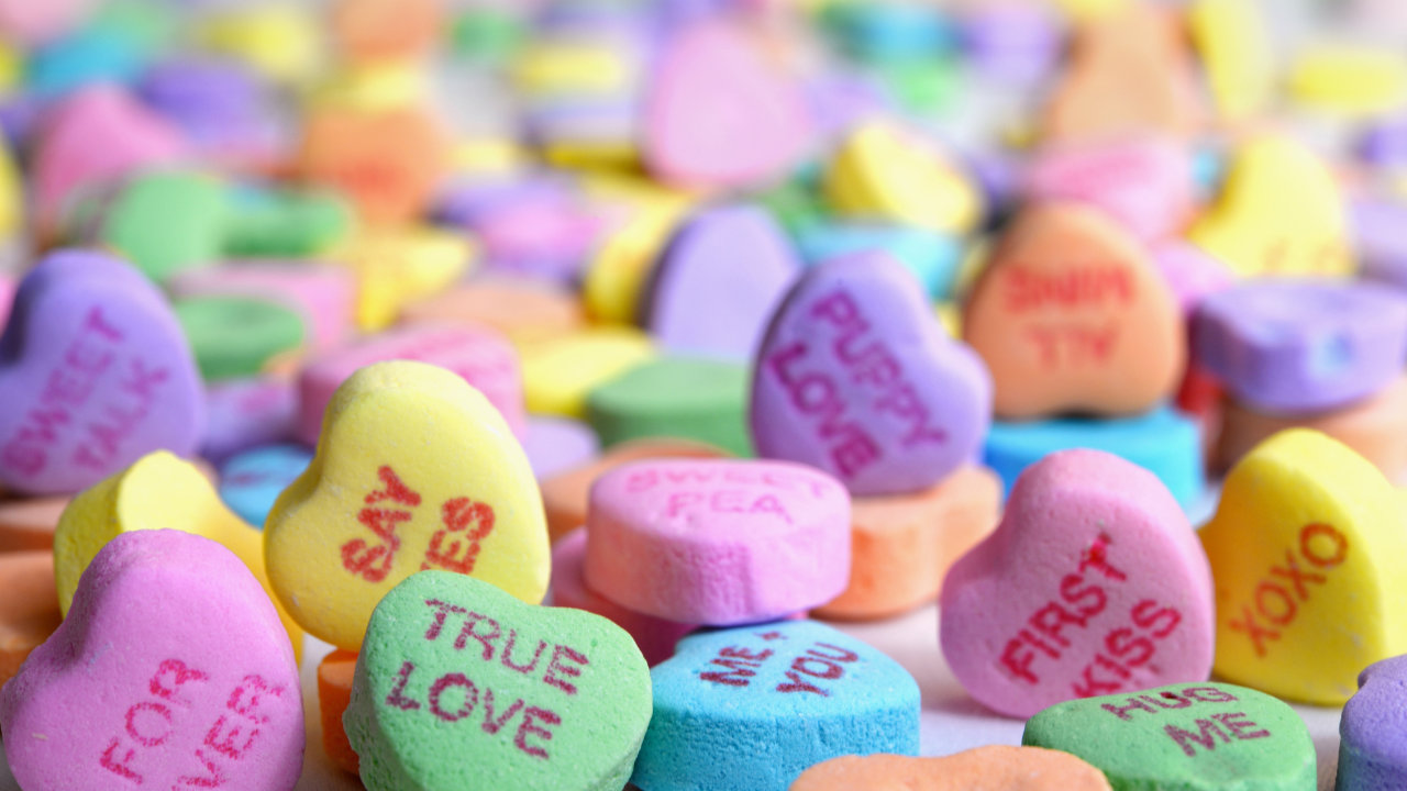 A large spread of candy hearts.