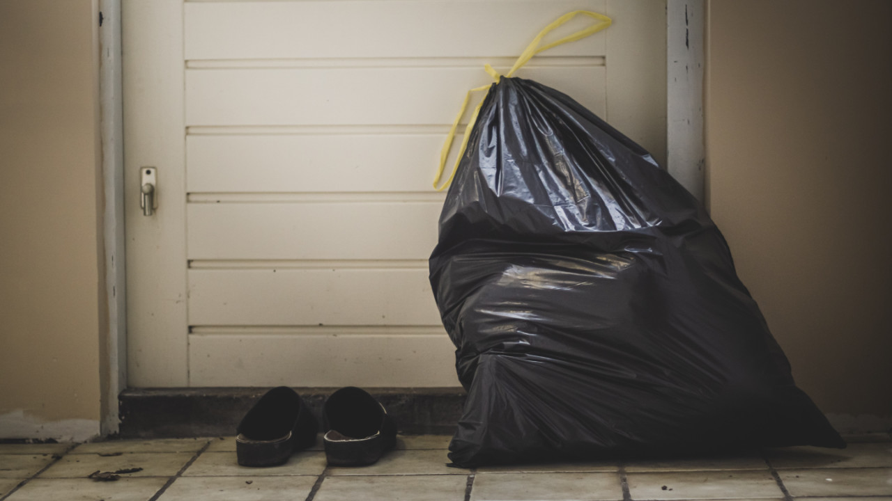 A bag of garbage by the door.