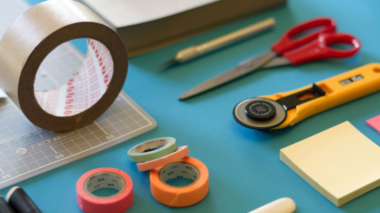 Duct tape, scissors, tape, and post-it notes