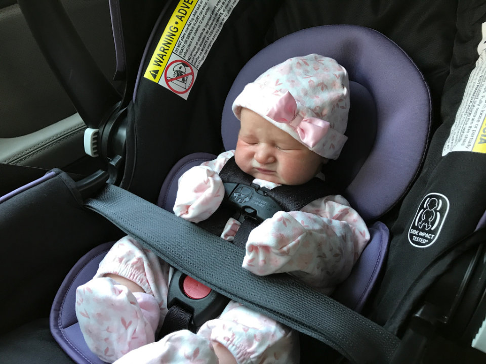Olivia in a carseat