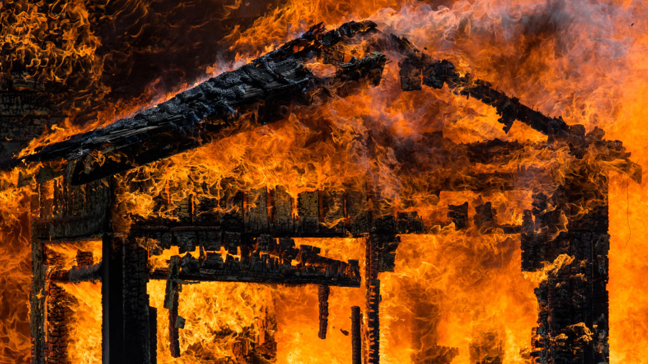 A raging fire destroying a house