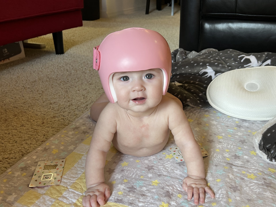 Olivia wearing her new helmet